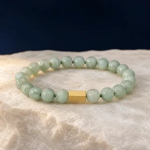 Green jade bracelet with natural tonal variation