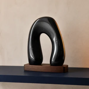 Minimal obsidian arch for a shelf or desk